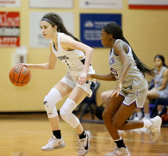 Keller guard Sarah Graves (1) crosses midcourt in front of Timber Creek guard Mackenzee Jones in the second half of a District 4-6A game Jan. 28, 2021, at Keller High School. Keller defeated Timber Creek 56-49.